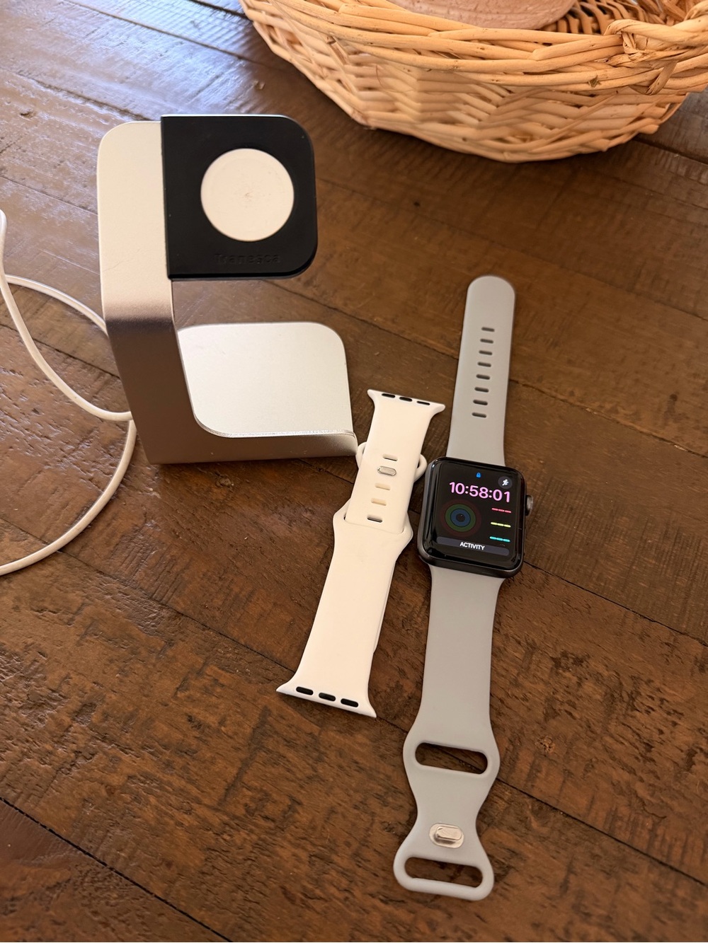 Apple Watch with Gray Sport Band and White Spare Silicone Band